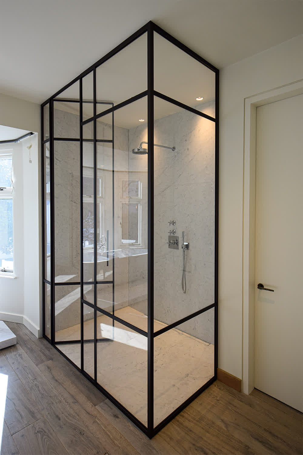 shower enclosure with a bronze frame