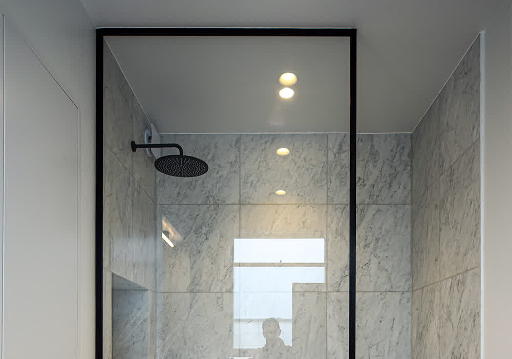 fixed shower screen with black frame