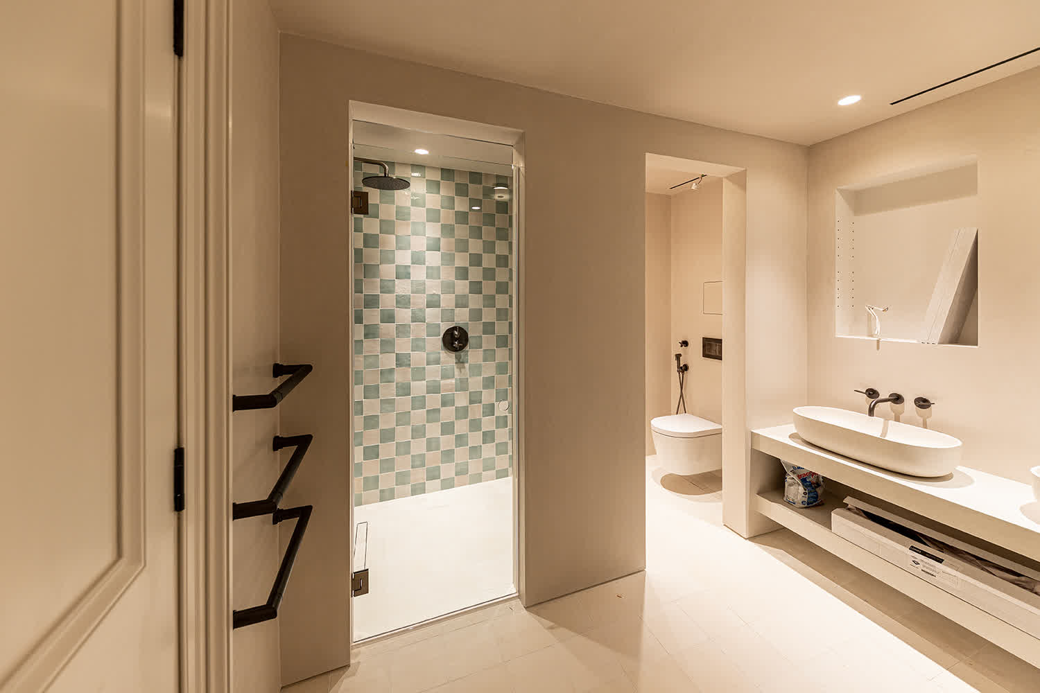 frameless shower door in a bright bathroom