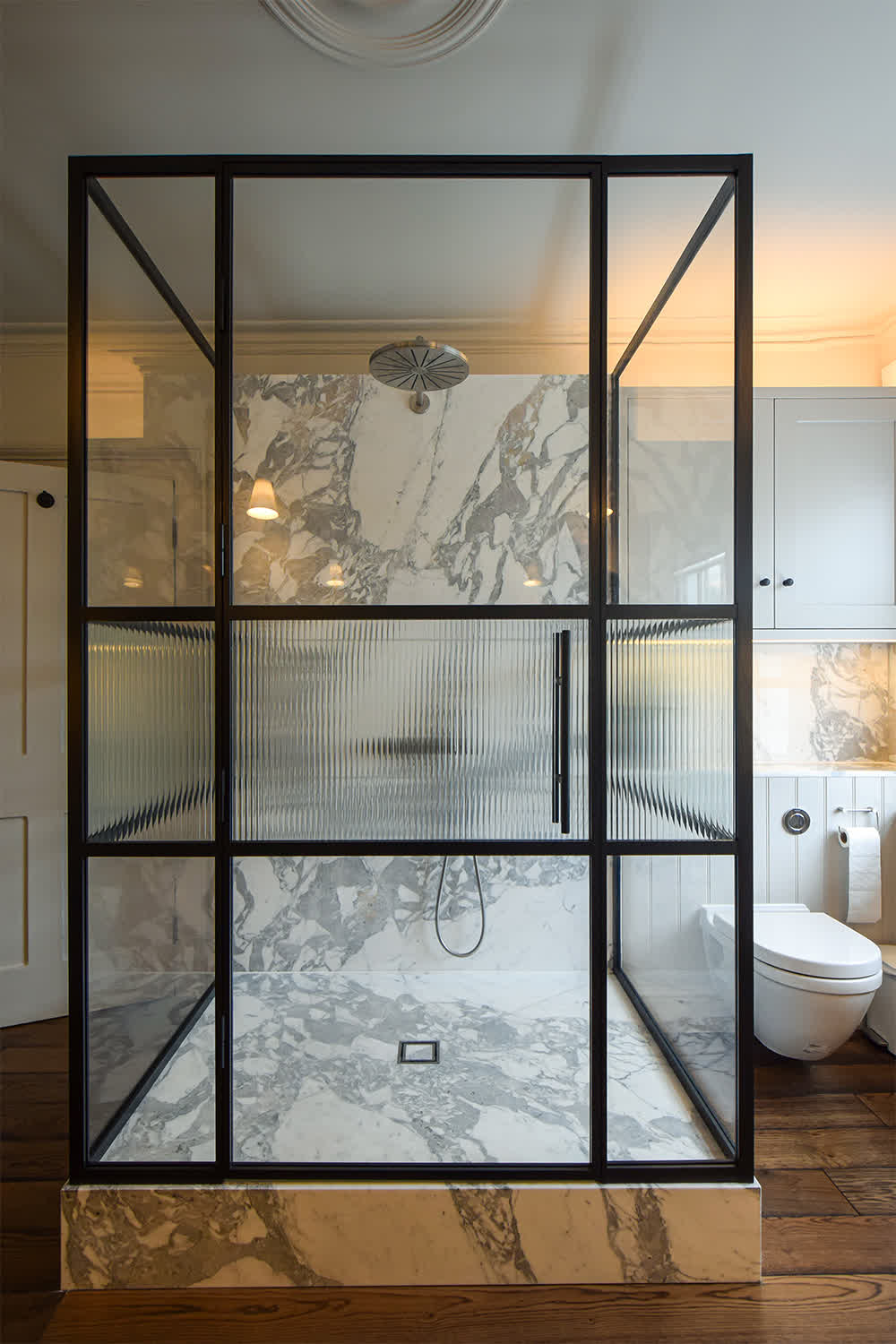 reeded glass shower enclosure with frame