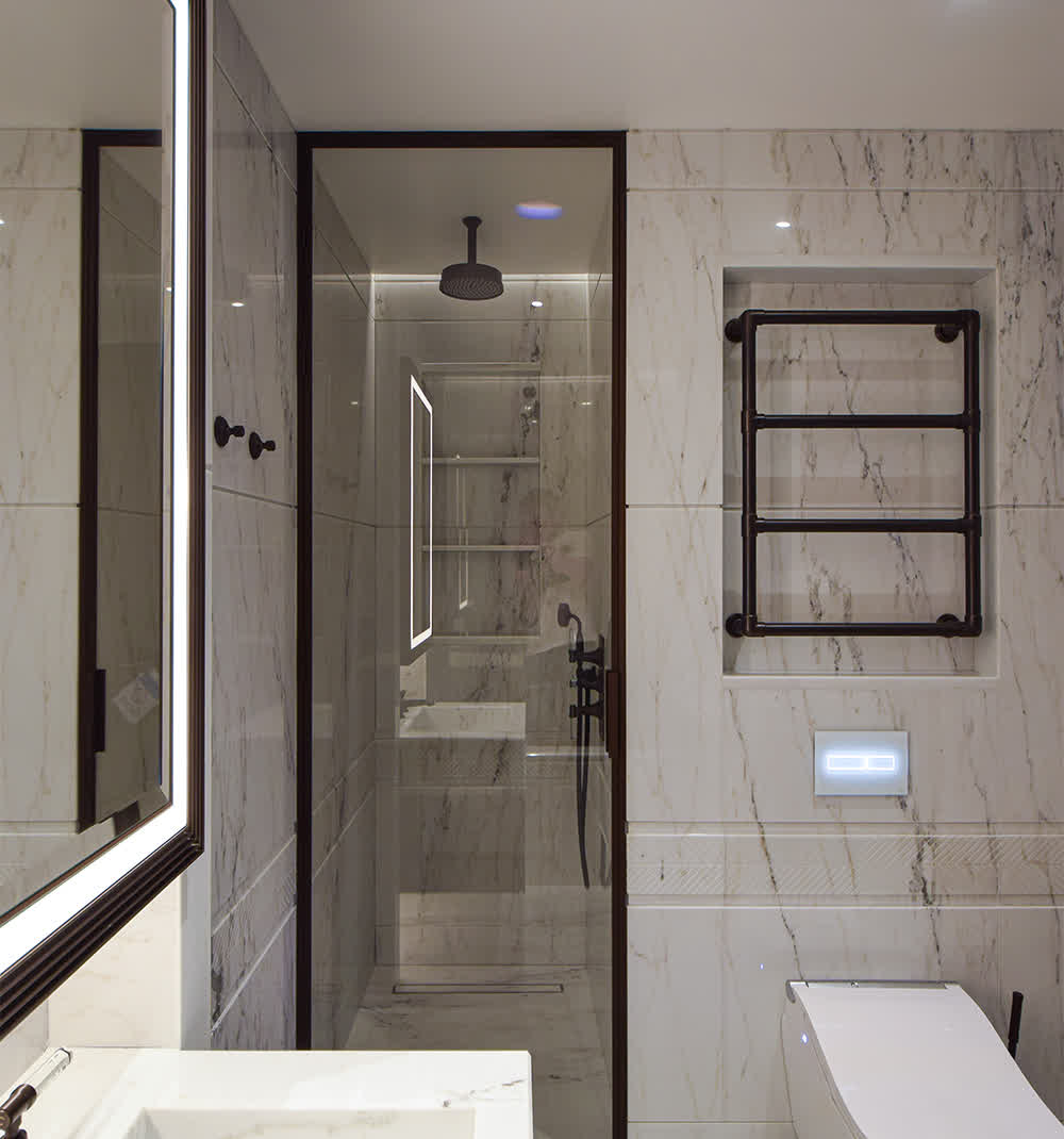 shower door in a bronze frame