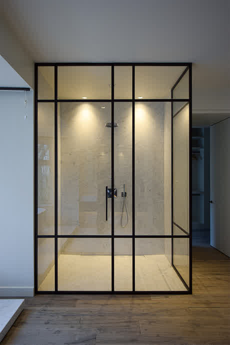 tall and wide shower enclosure with bronze frame and middle bars